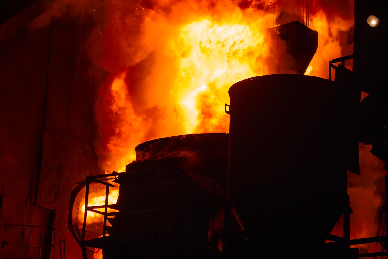 Dramatic image of a blazing industrial furnace with intense flames.